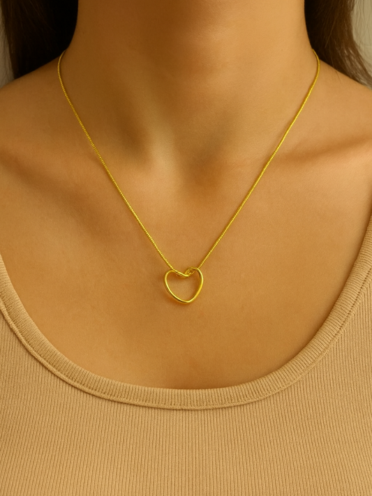 Gold necklace with a heart pendant