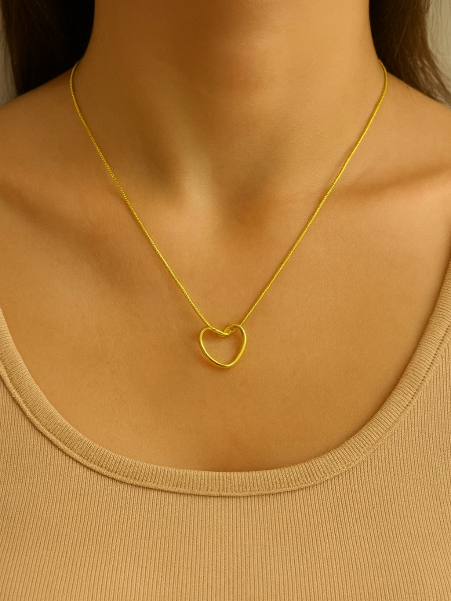 Gold necklace with a heart pendant