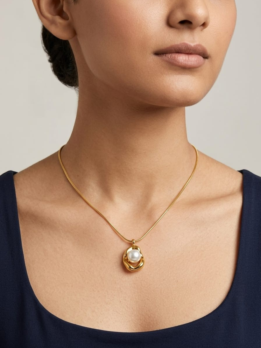 A model is wearing our Luxury Round Pearl Charm Pendant Gold Necklace