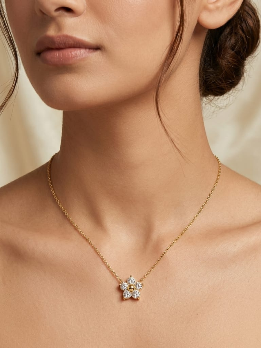 A model is wearing our White Flower Pendant Minimal Golden Chain Necklace