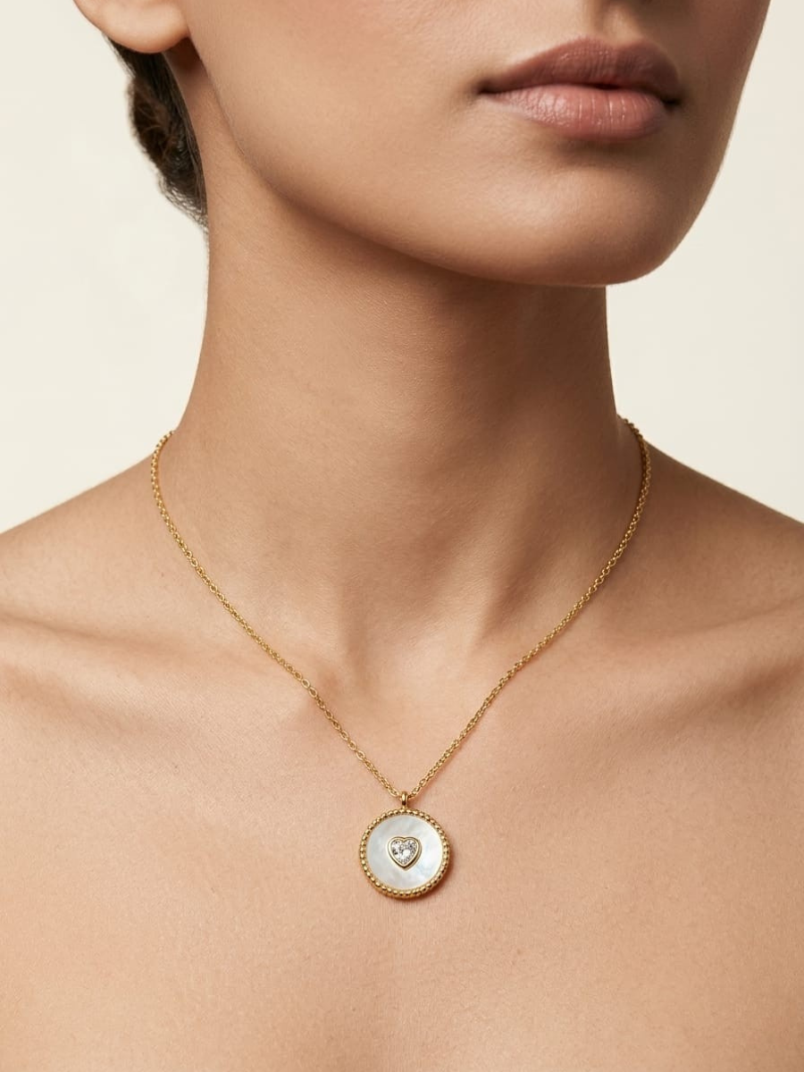 A model is wearing our Aurelia White Enamel Crystal Medallion Golden Chain Necklace
