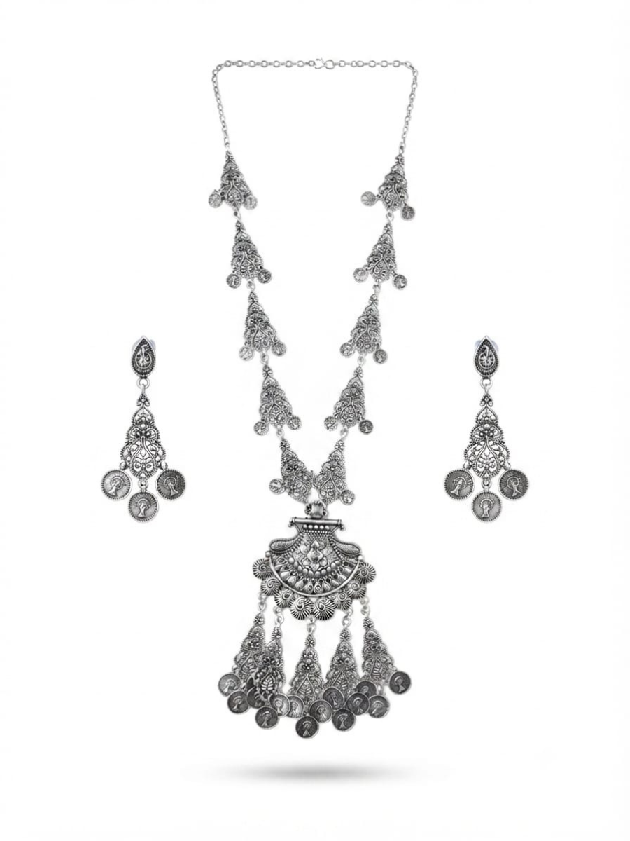 A silver-toned traditional jewelry set featuring a long chain necklace with multiple dangling coin-style charms, matching drop earrings, and a decorative pendant