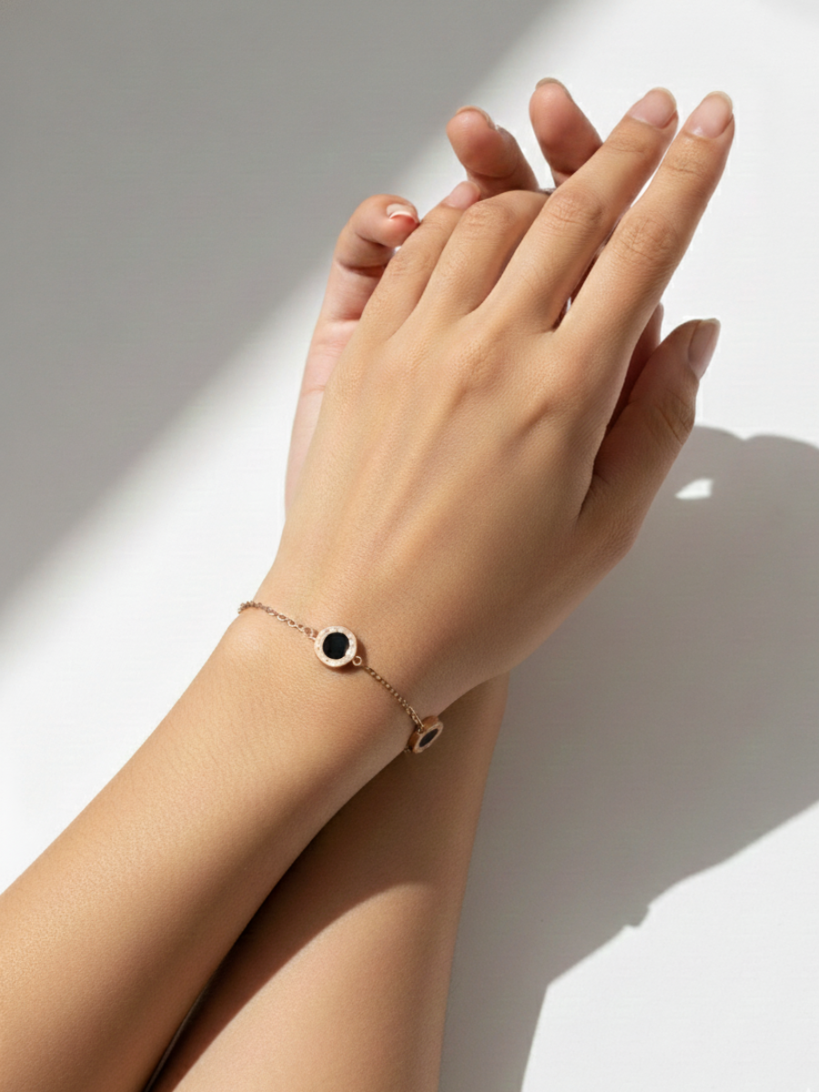 An Indian Model wearing our Black Stone Studded Rose Gold Minimal Statement Bracelet