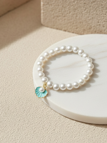 Buy Blue Shell Charm White Pearls Beaded Handmade Bracelet Online in India - TheJewelbox