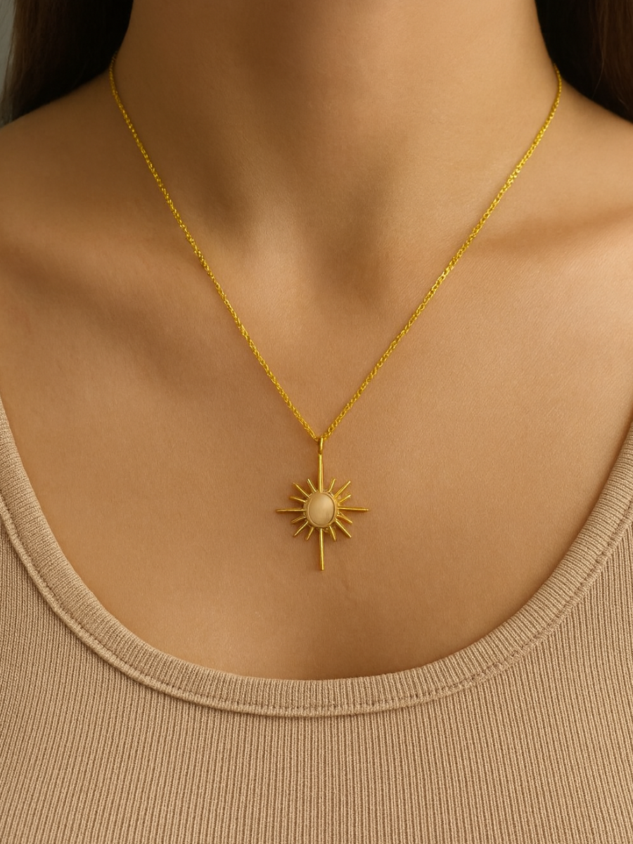 Gold necklace with a sun pendant