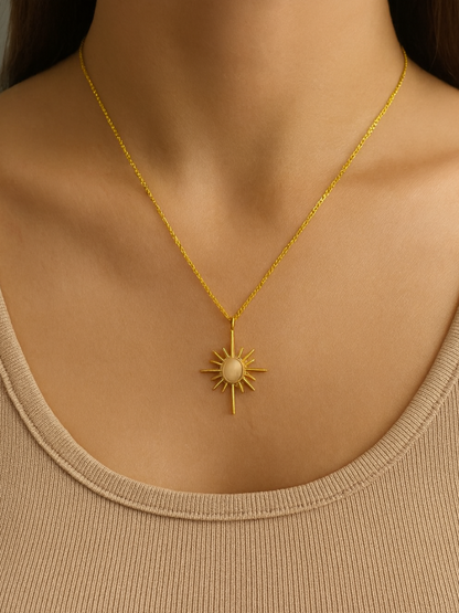 Gold necklace with a sun pendant