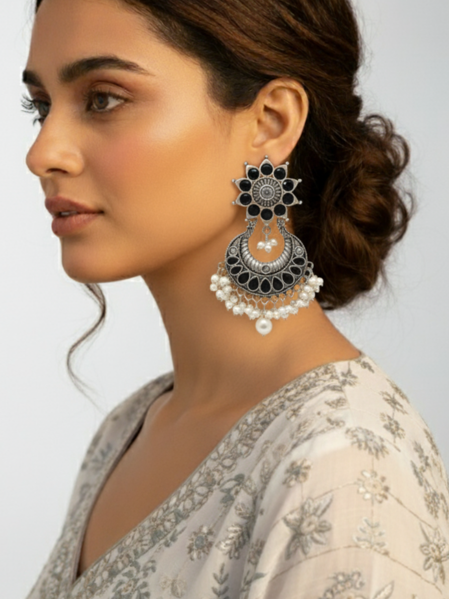 An Indian Model wearing our Classic German Silver Oxidised Black Stone Dangle Earrings
