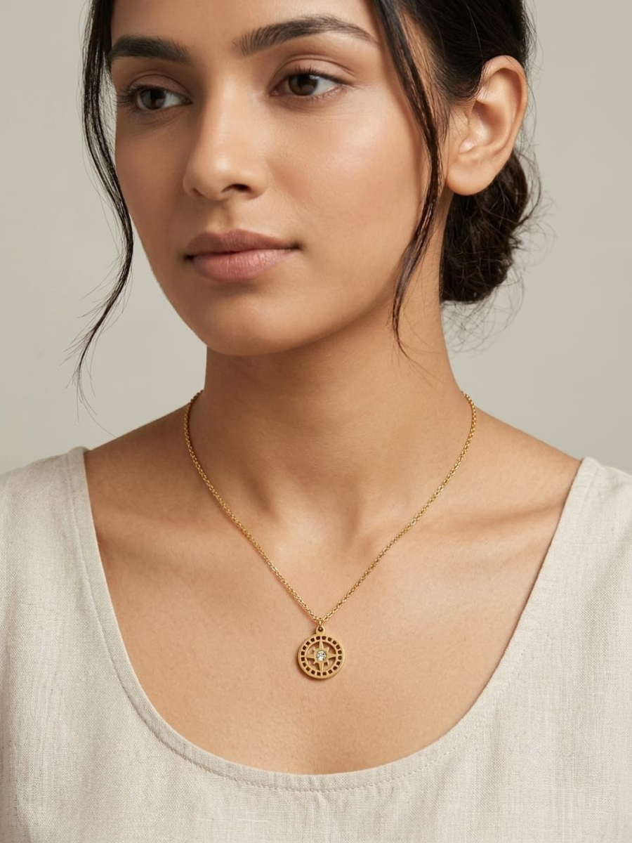A woman is wearing our Crystal Center Round Medallion Pendant Golden Chain Necklace