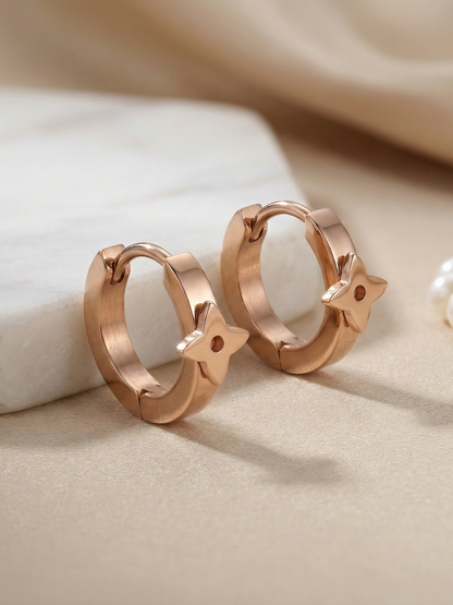 Rose gold clover huggie earrings