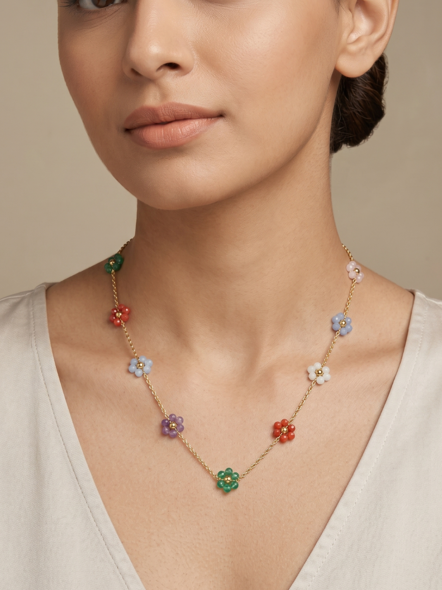 A model is wearing our Dainty Colourful Beaded Flower Charms Golden Chain Necklace