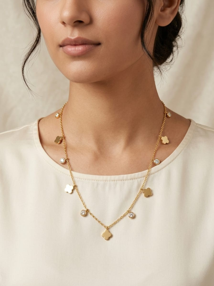 A model is wearing our Diamond and Floral Charms Golden Minimal Chain Necklace
