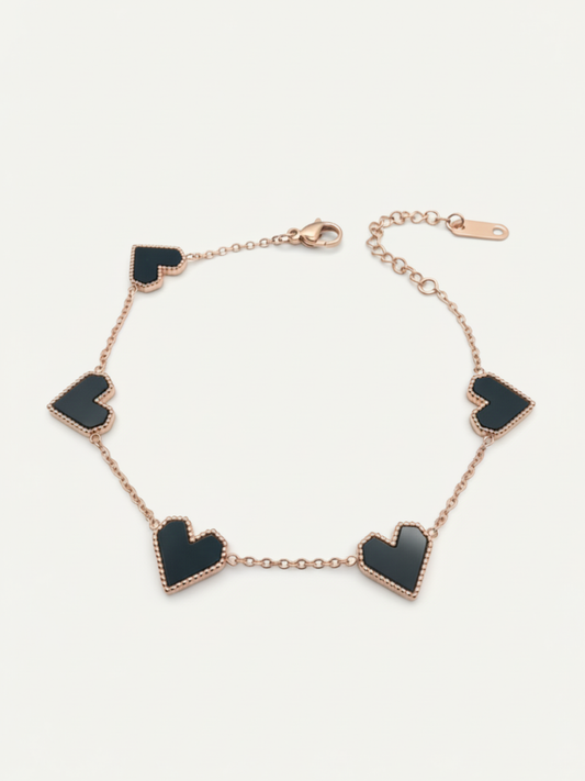 Rose gold bracelet with black hearts