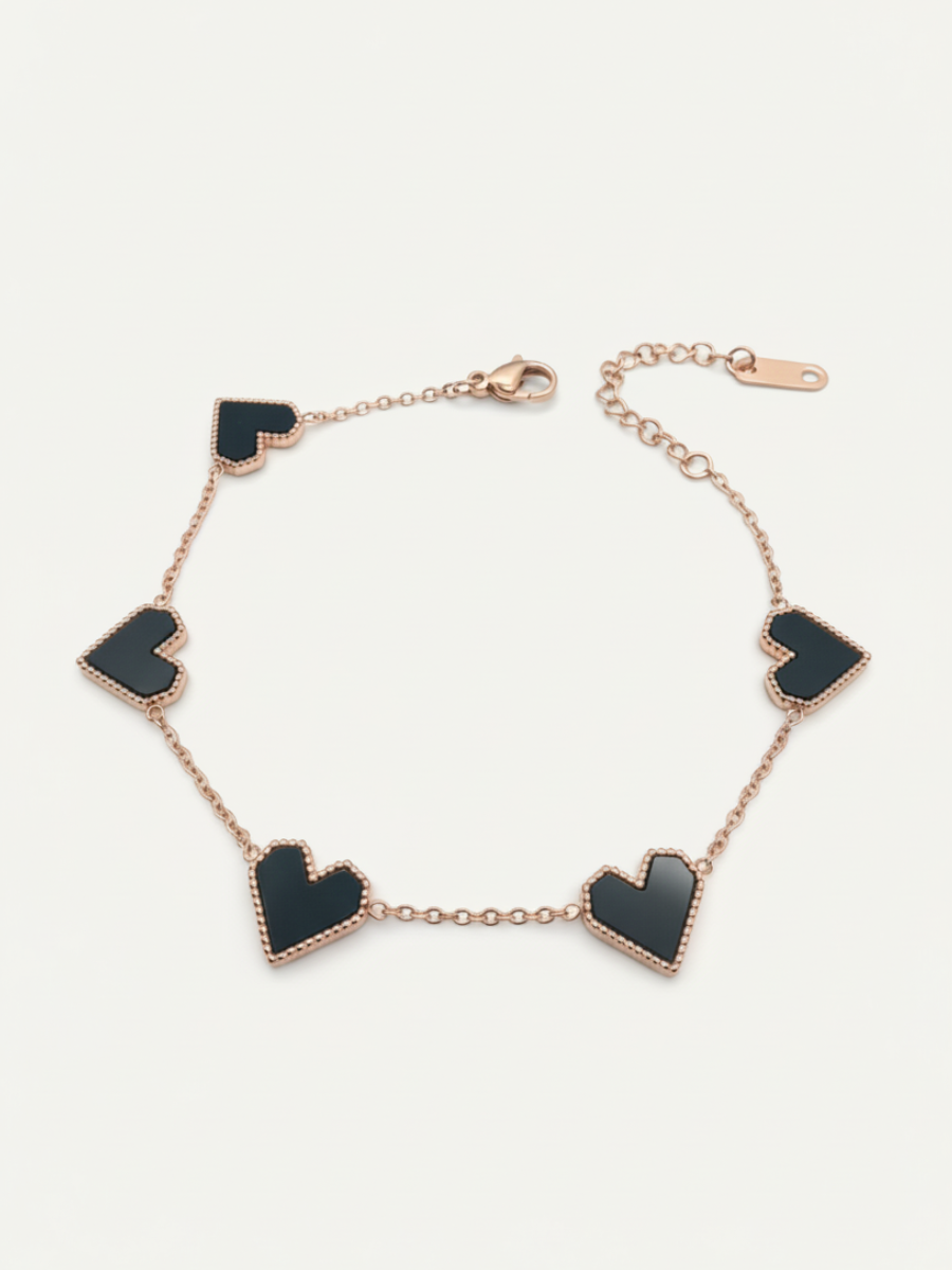 Rose gold bracelet with black hearts