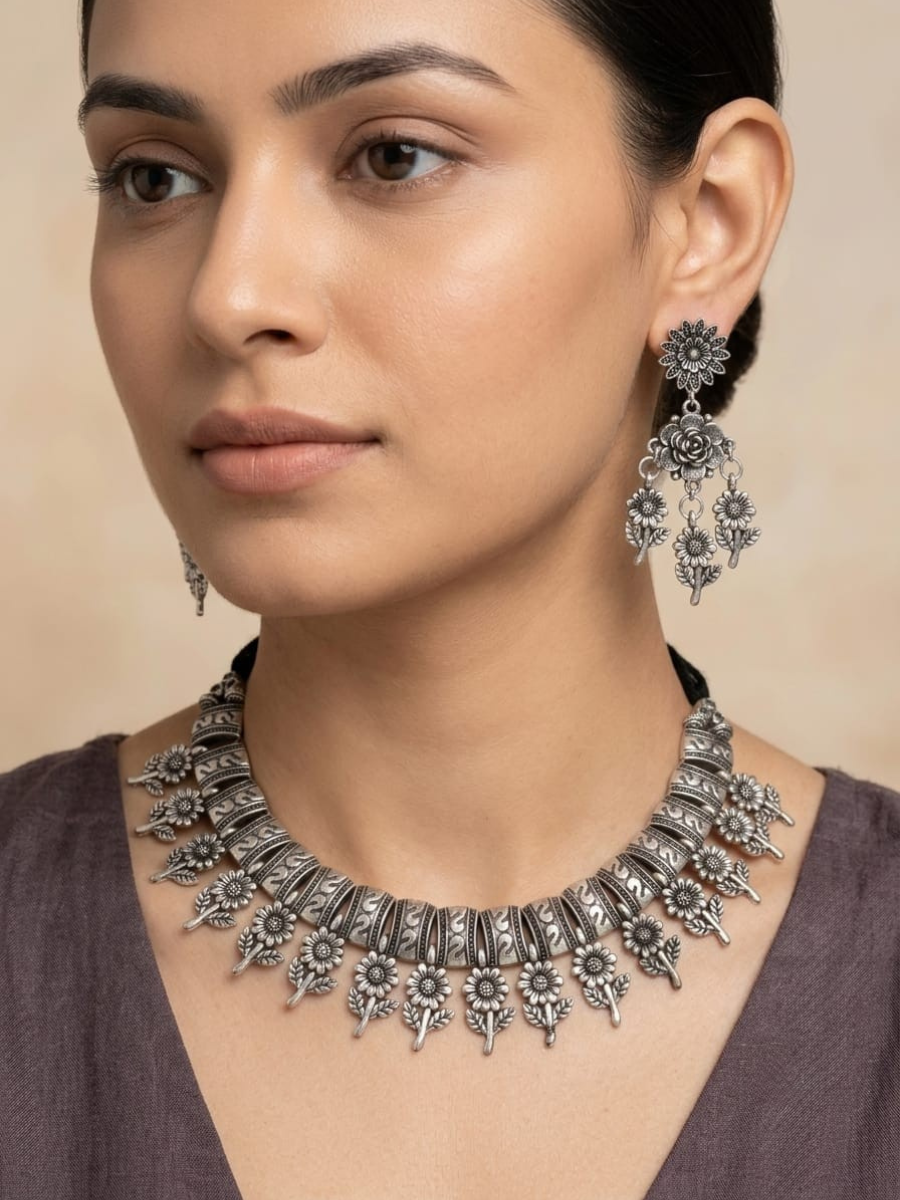 A model is wearing our Floral Hangings Oxidised Silver Choker Necklace Set