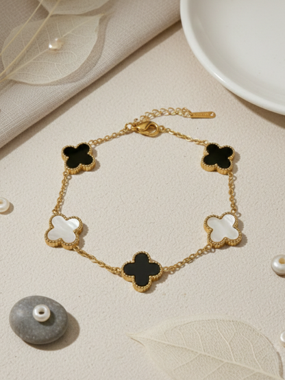 Buy Gold Plated Black and White Reversible Clover Charm Bracelet Online