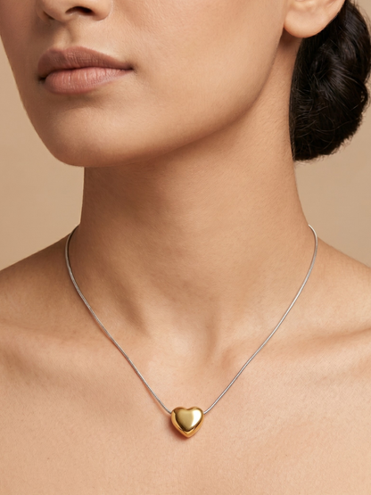 A model is wearing our Golden Heart Pendant Minimal Silver Chain Necklace