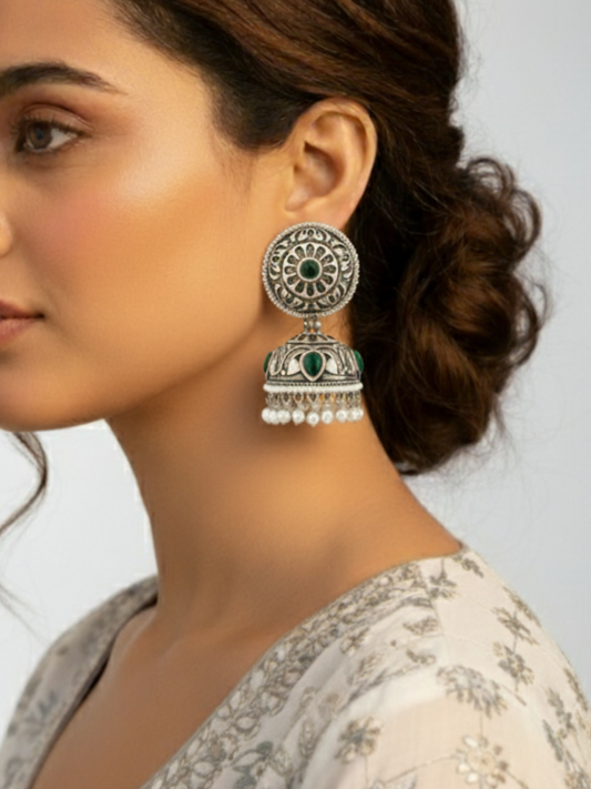 An Indian model wearing our Green Stone German Silver Oxidised Jhumka Earrings