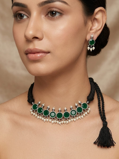 A model is wearing our Green Stones German Silver Oxidised Thread Necklace Set