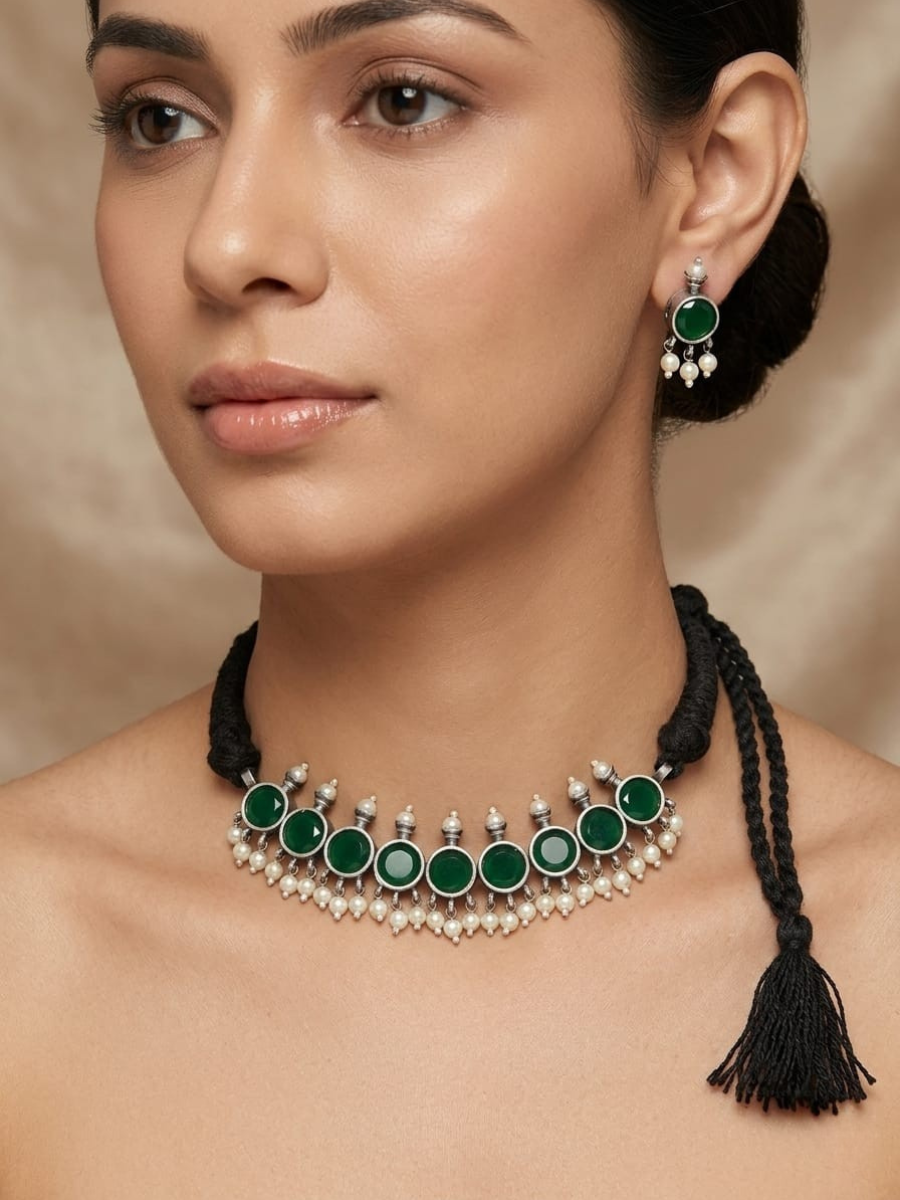 A model is wearing our Green Stones German Silver Oxidised Thread Necklace Set