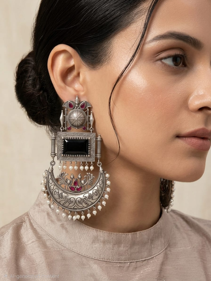 Traditional earrings with black gemstones