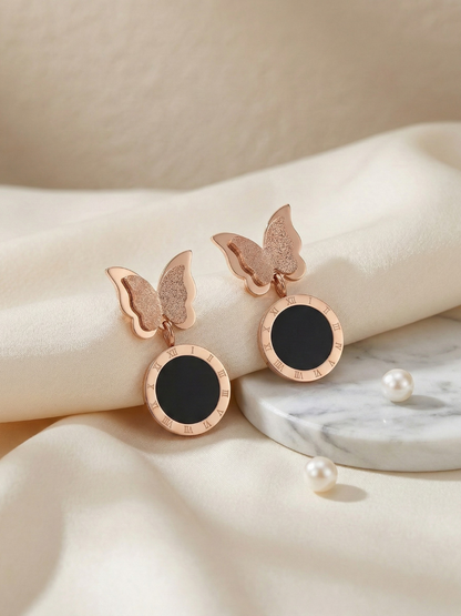 Rose gold butterfly dangle earrings