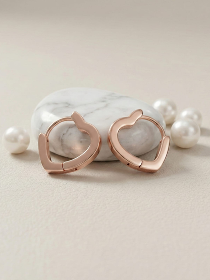Rose gold heart huggie earrings