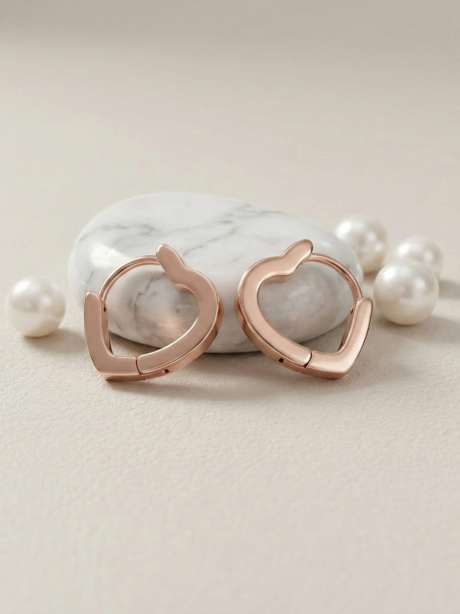 Rose gold heart huggie earrings