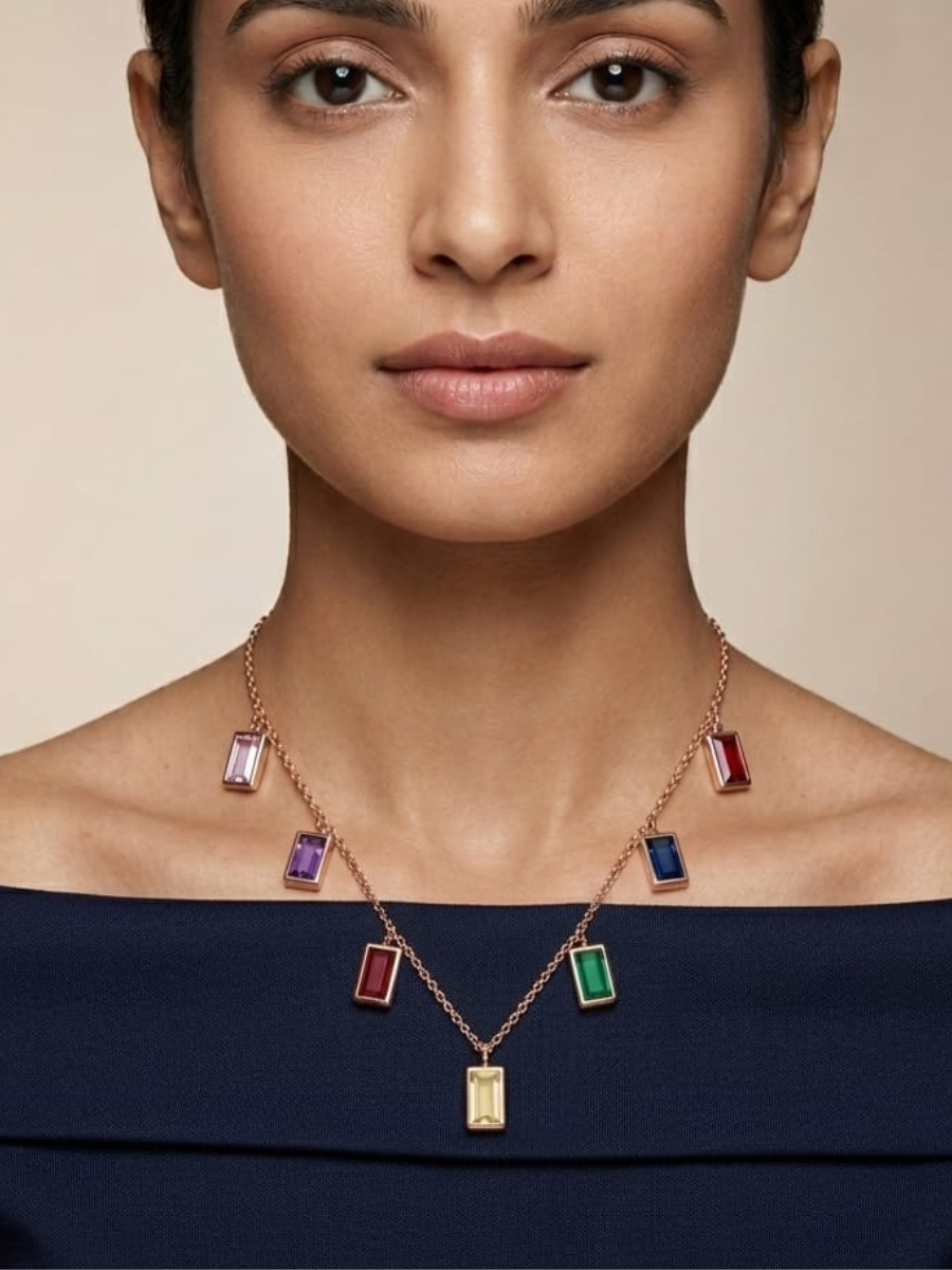A model is wearing our Multi Color Rectangle Charms Rose Gold Chain Necklace