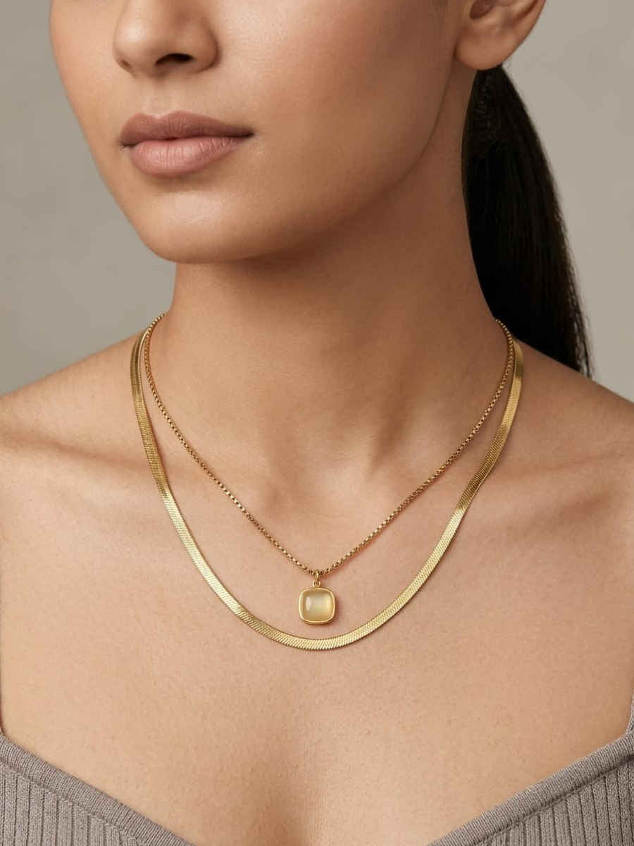 A model is wearing our Off White Square Pendant Golden Plated Double Chain Necklace