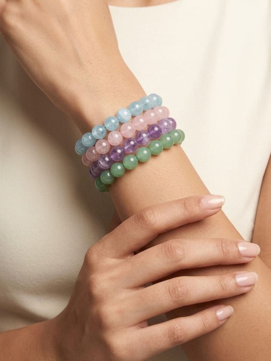 A model is wearing our Pastel Pink, Green, Blue and Purple Handmade Beaded Bracelets