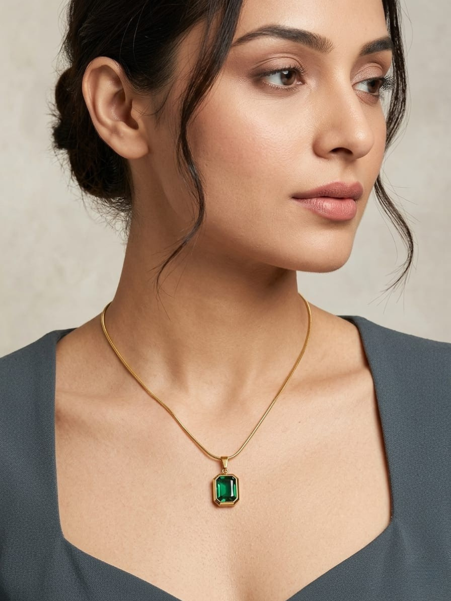 A model is wearing our Rectangular Green Crystal Pendant Gold Chain Necklace