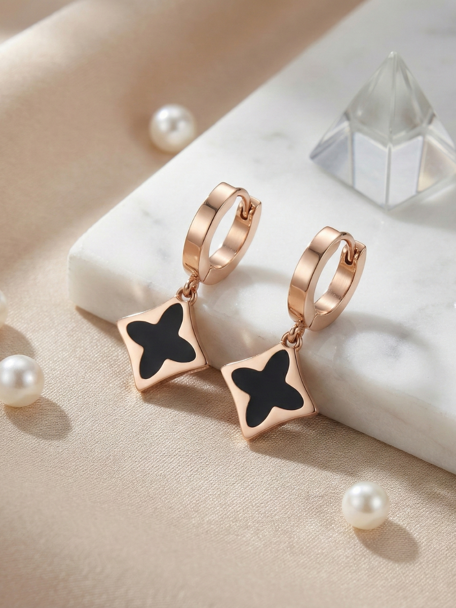 Rose gold black clover huggie earrings