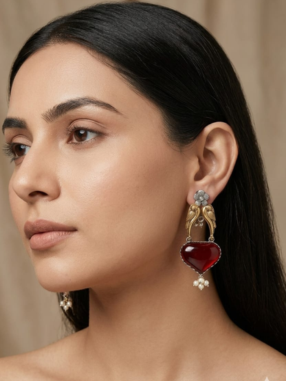 A model is wearing our Ruby Red Monalisa Stone Dual Tone Oxidised Stud Earrings