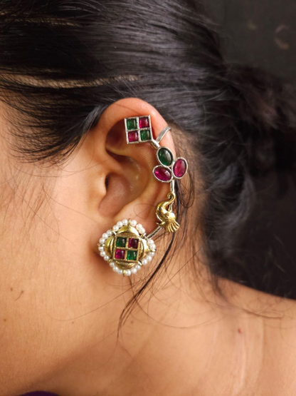 Close-up of an ear with Ruby Red and Green Stone Dual Tone Oxidised Earcuff Earrings