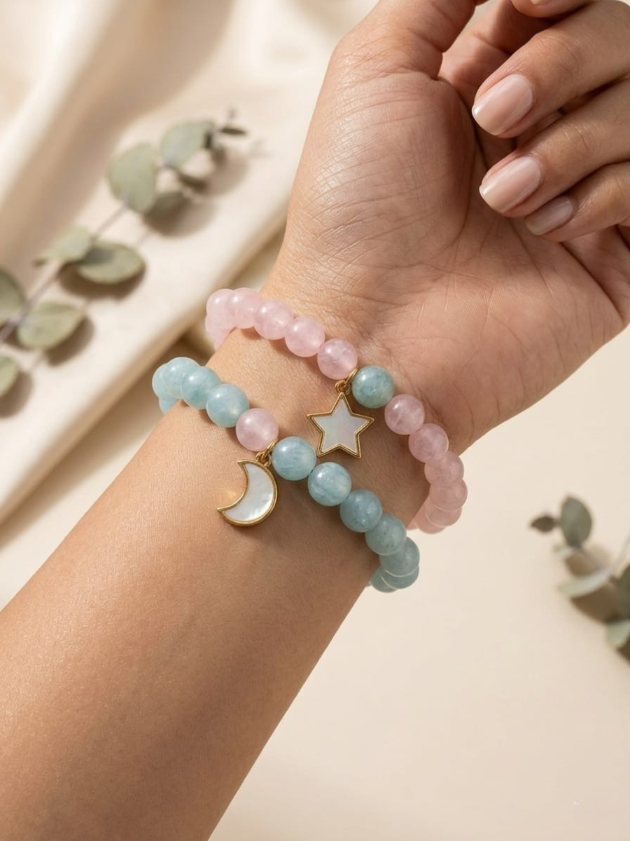 A model wearing Star and Moon Charms Pink and Sky Blue Beaded Bracelets